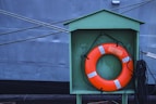 a life preserver in front of a large ship