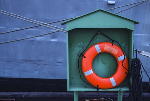 a life preserver in front of a large ship