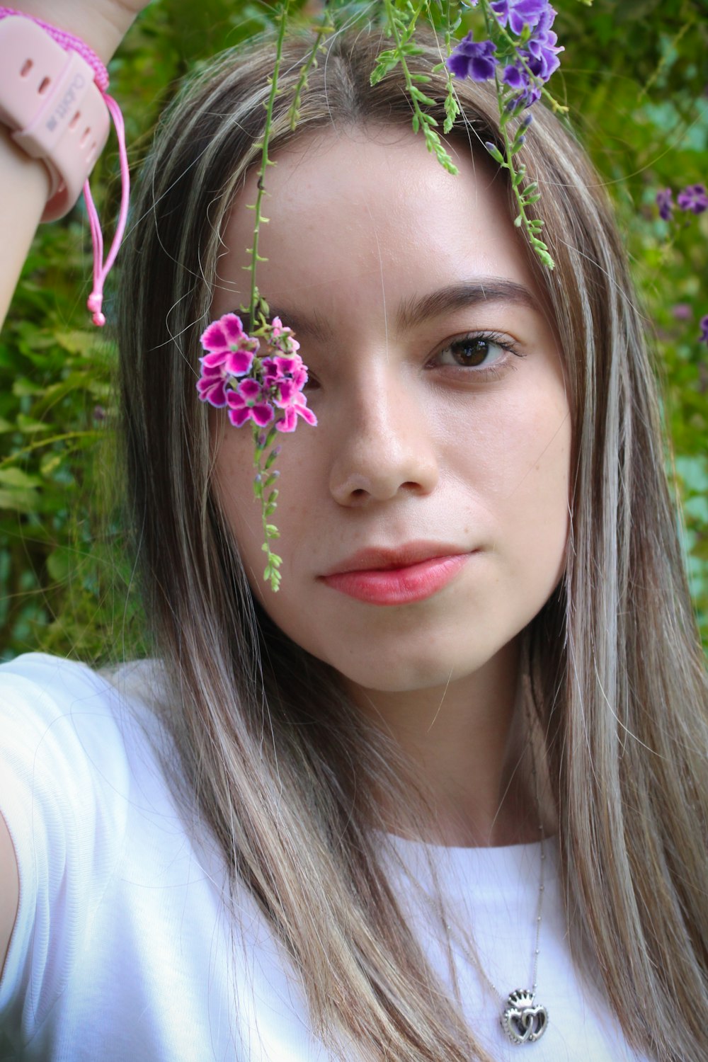 a girl with long hair and flowers in her hair
