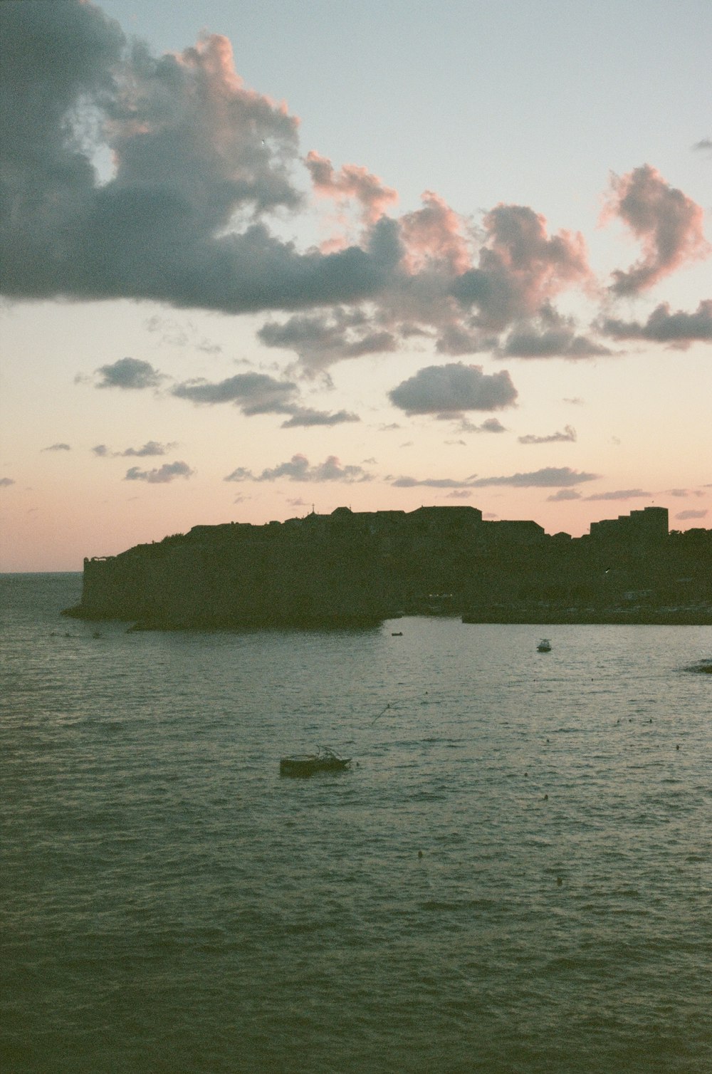 a body of water with a small island in the distance