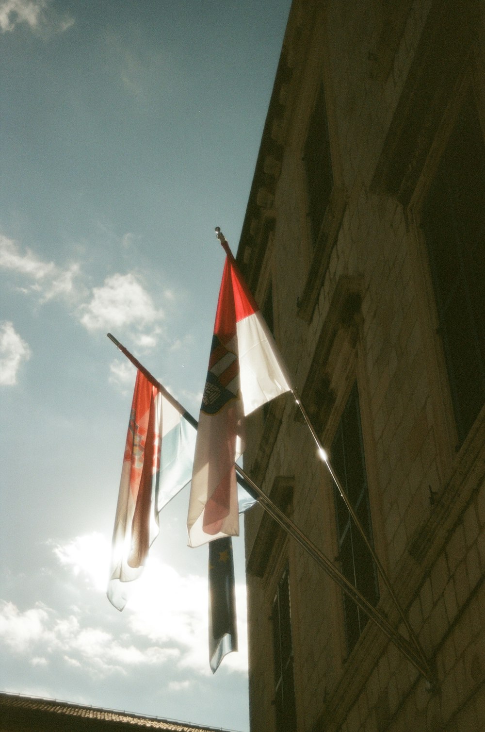 a couple of flags that are on a pole