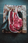 a piece of meat sitting on top of a piece of paper