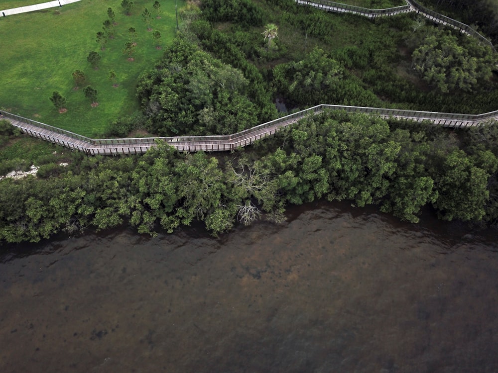 an aerial view of a river and a bridge