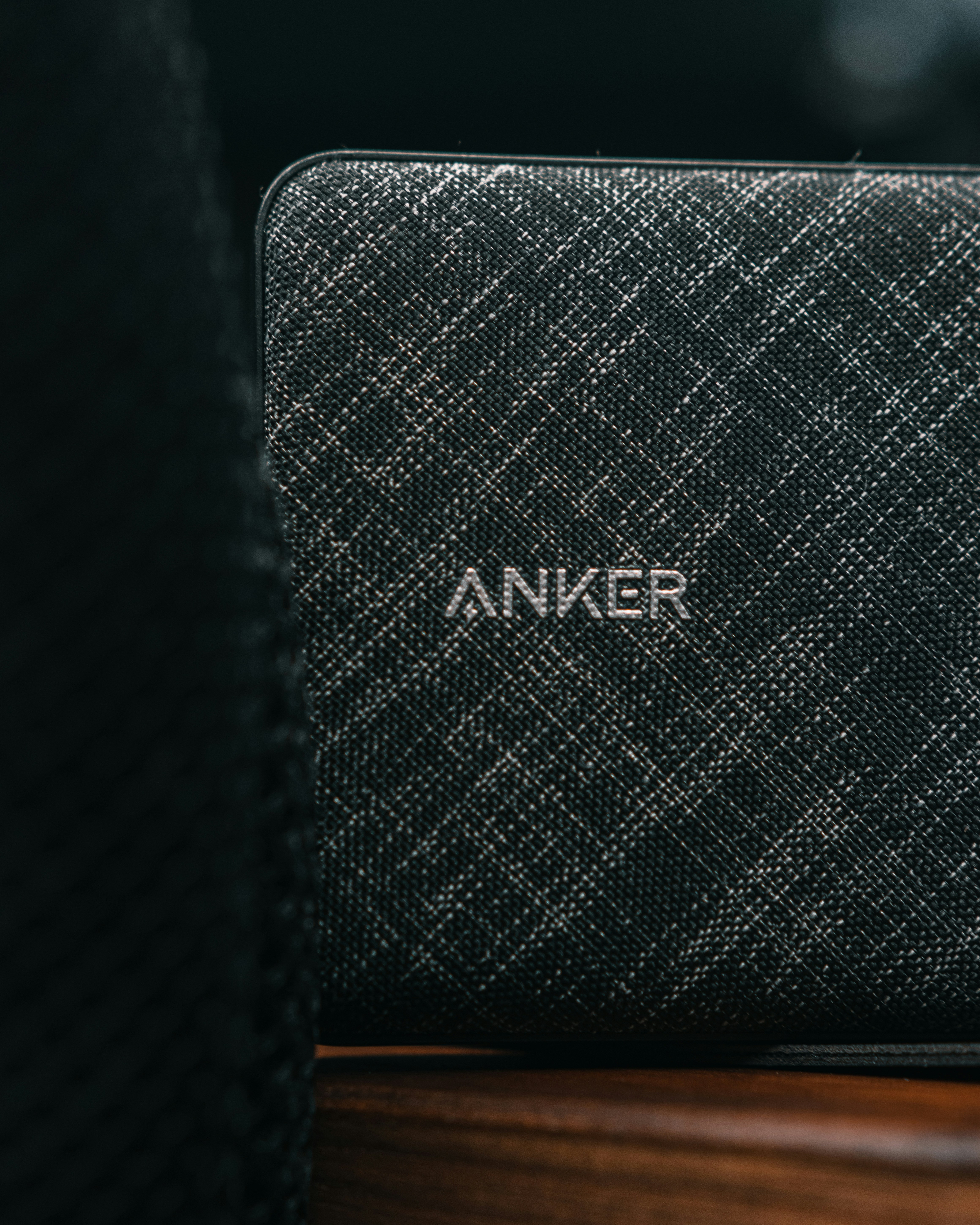 a speaker sitting on top of a wooden table