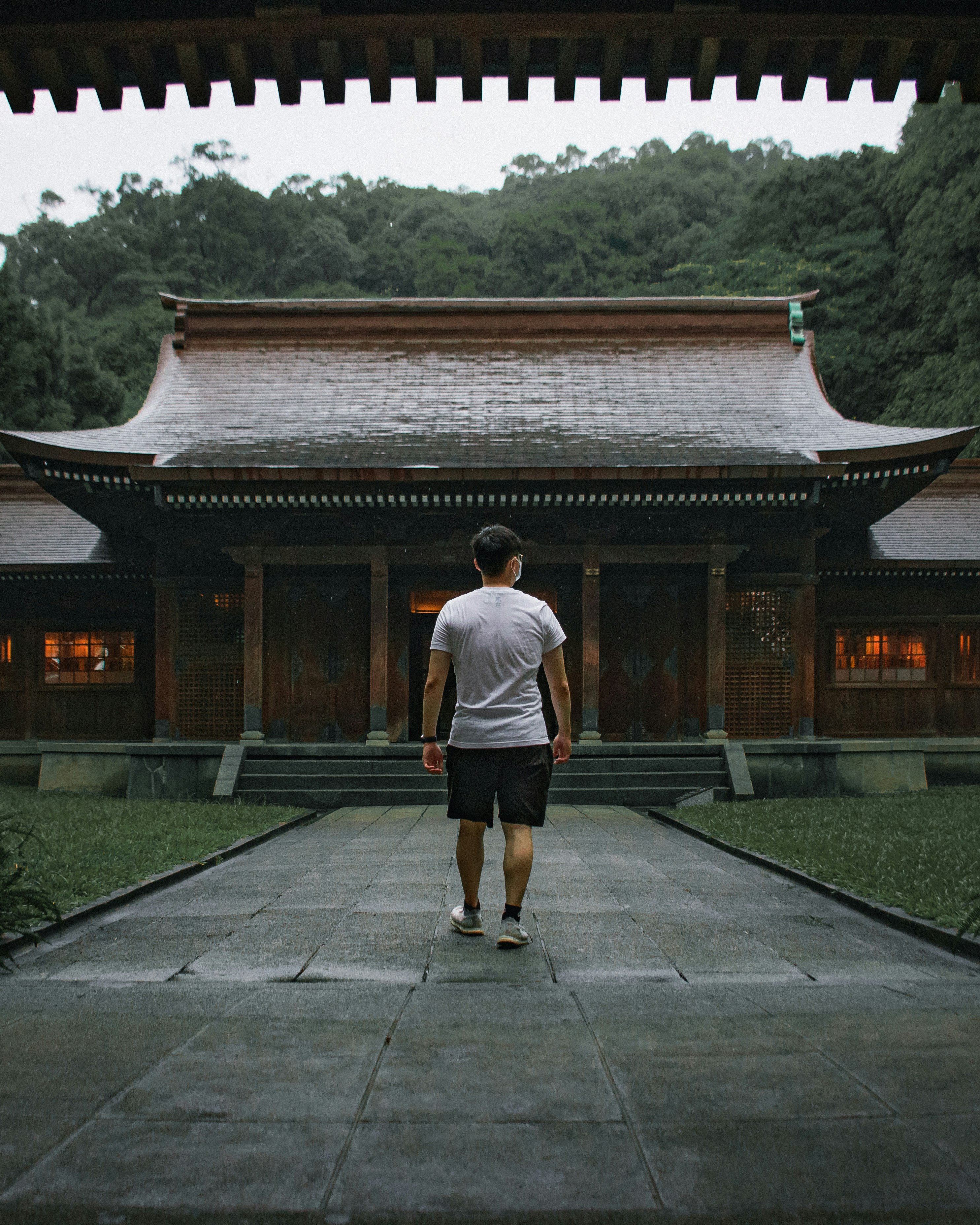 a man standing in front of a building