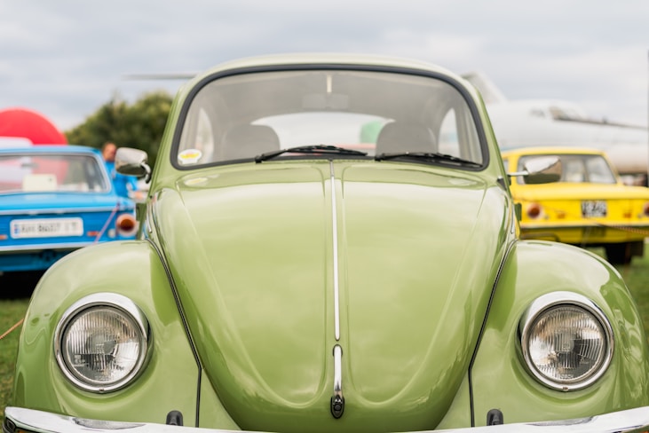 a close up of the front of a green car