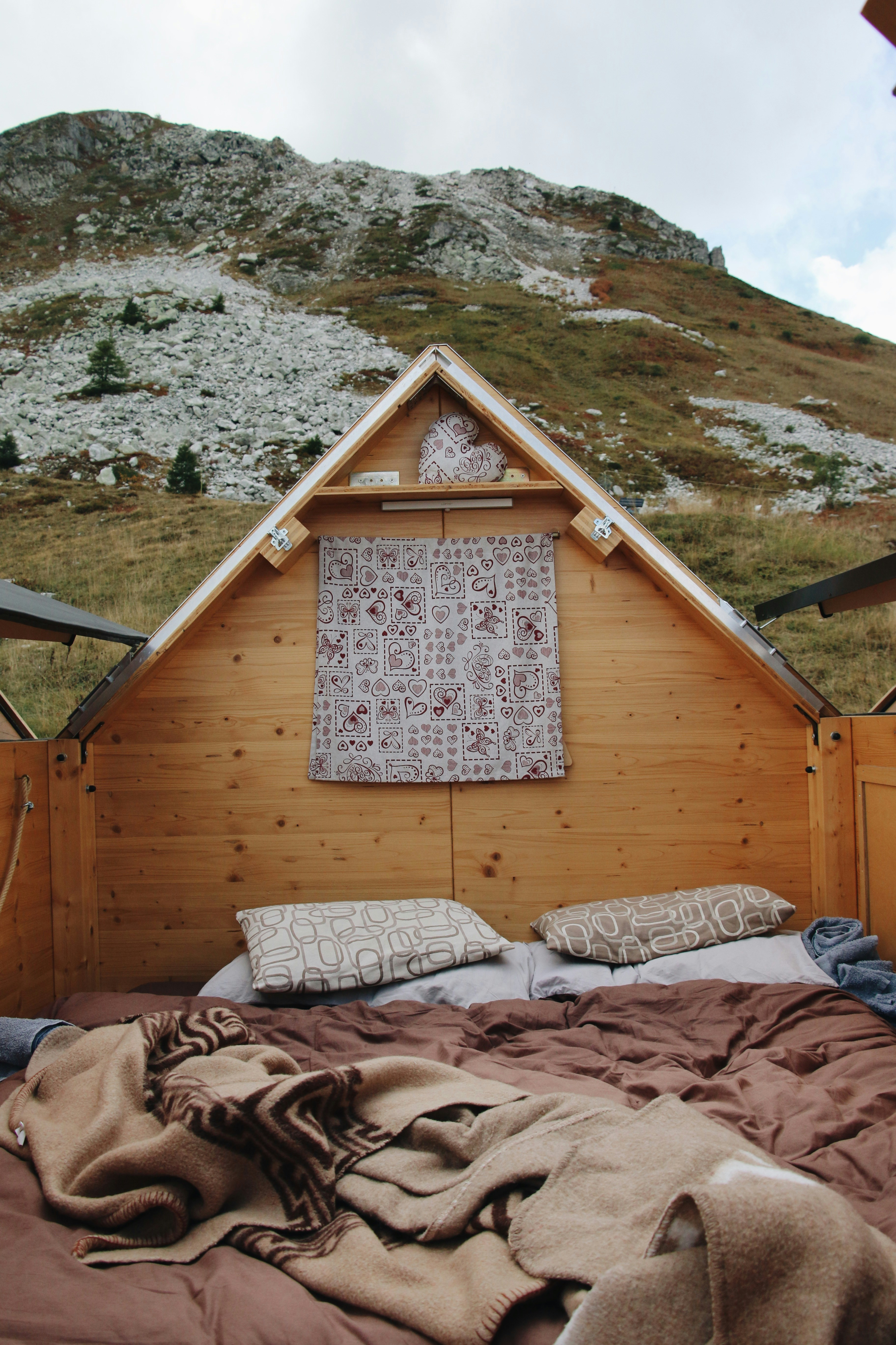a bed with a blanket on top of it