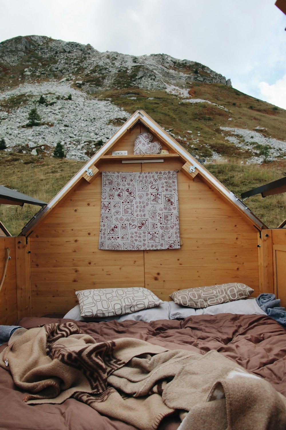 a bed with a blanket on top of it