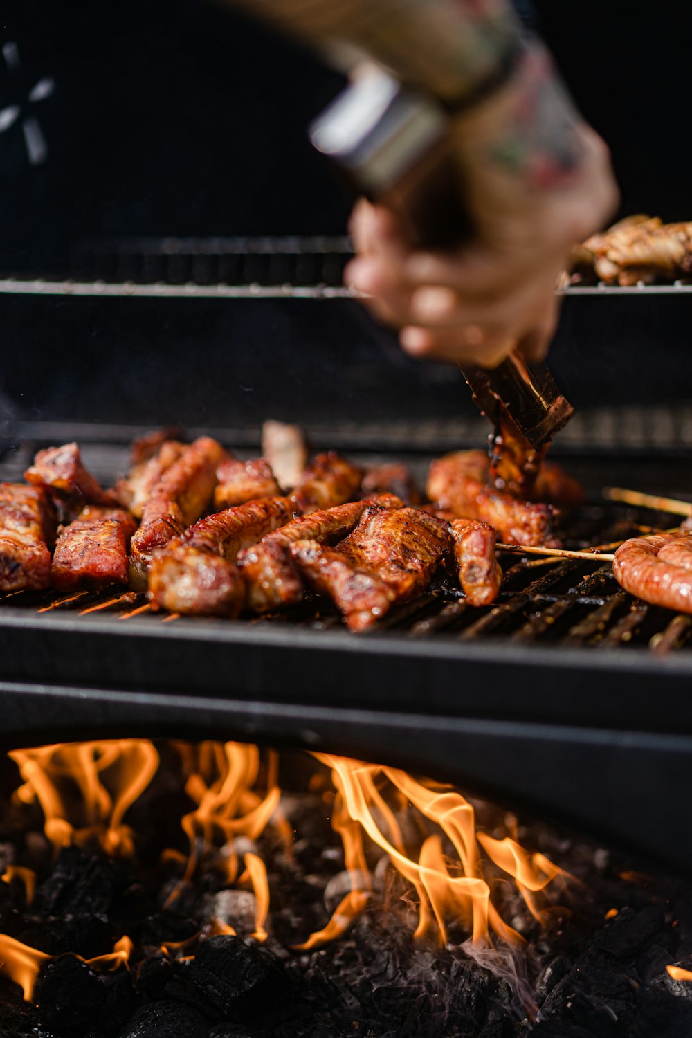 a person is cooking food on a grill