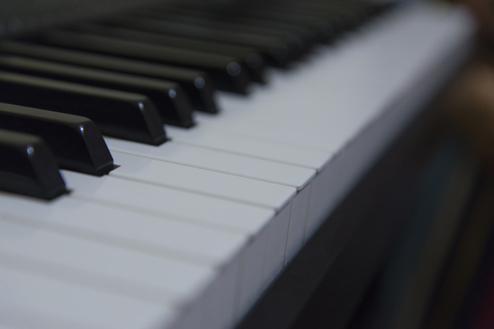 a close up of a black and white piano