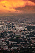 a view of a city under a cloudy sky