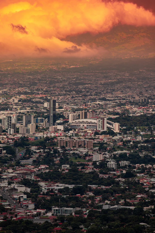 a view of a city under a cloudy sky