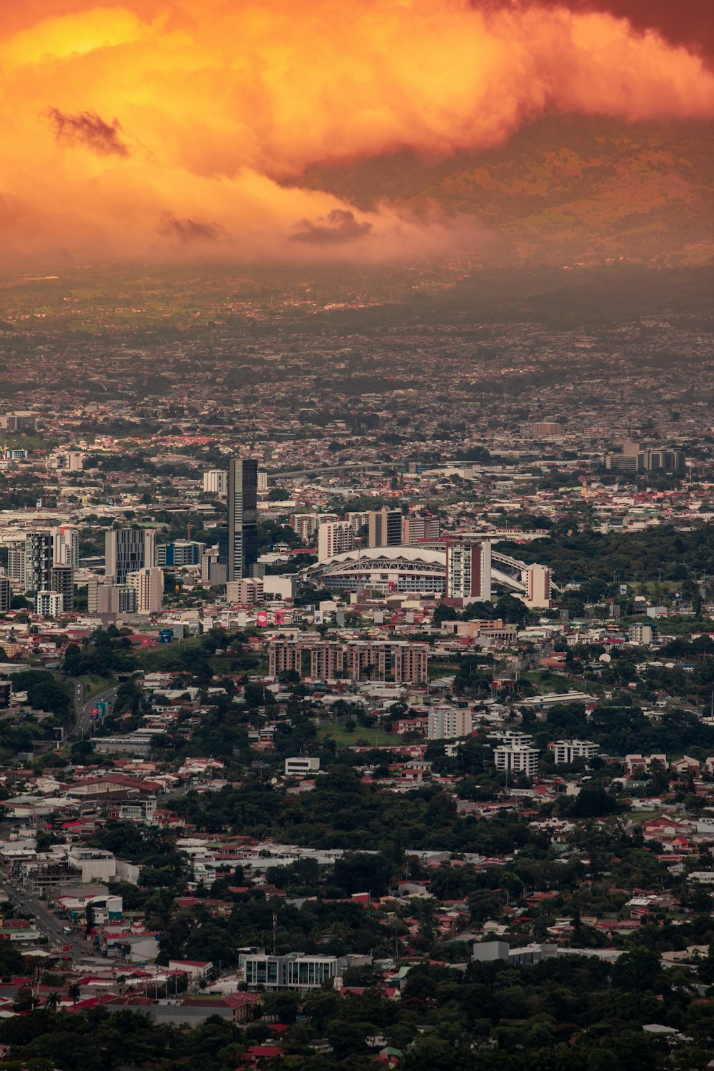 a view of a city under a cloudy sky