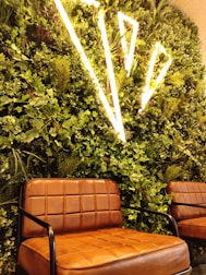 Lush green rooftop garden with integrated seating and soft lighting.