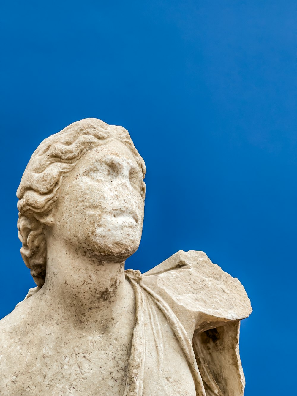 a close up of a statue of a woman