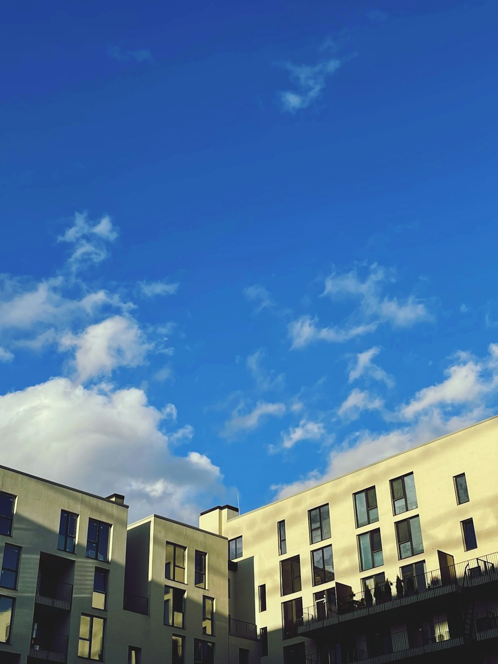 a blue sky with some clouds in the background