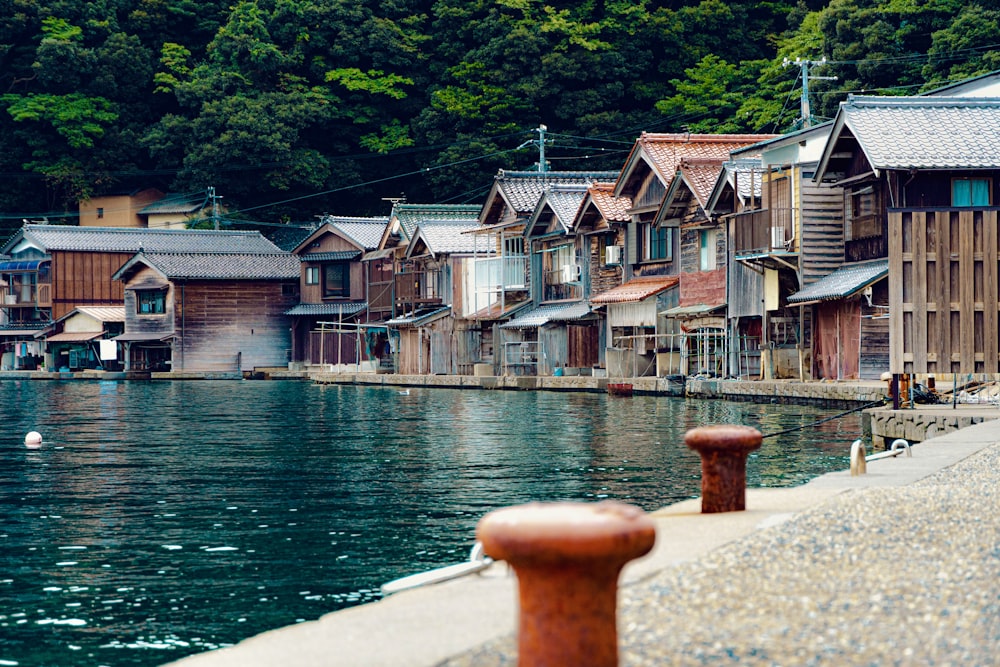a body of water surrounded by wooden buildings