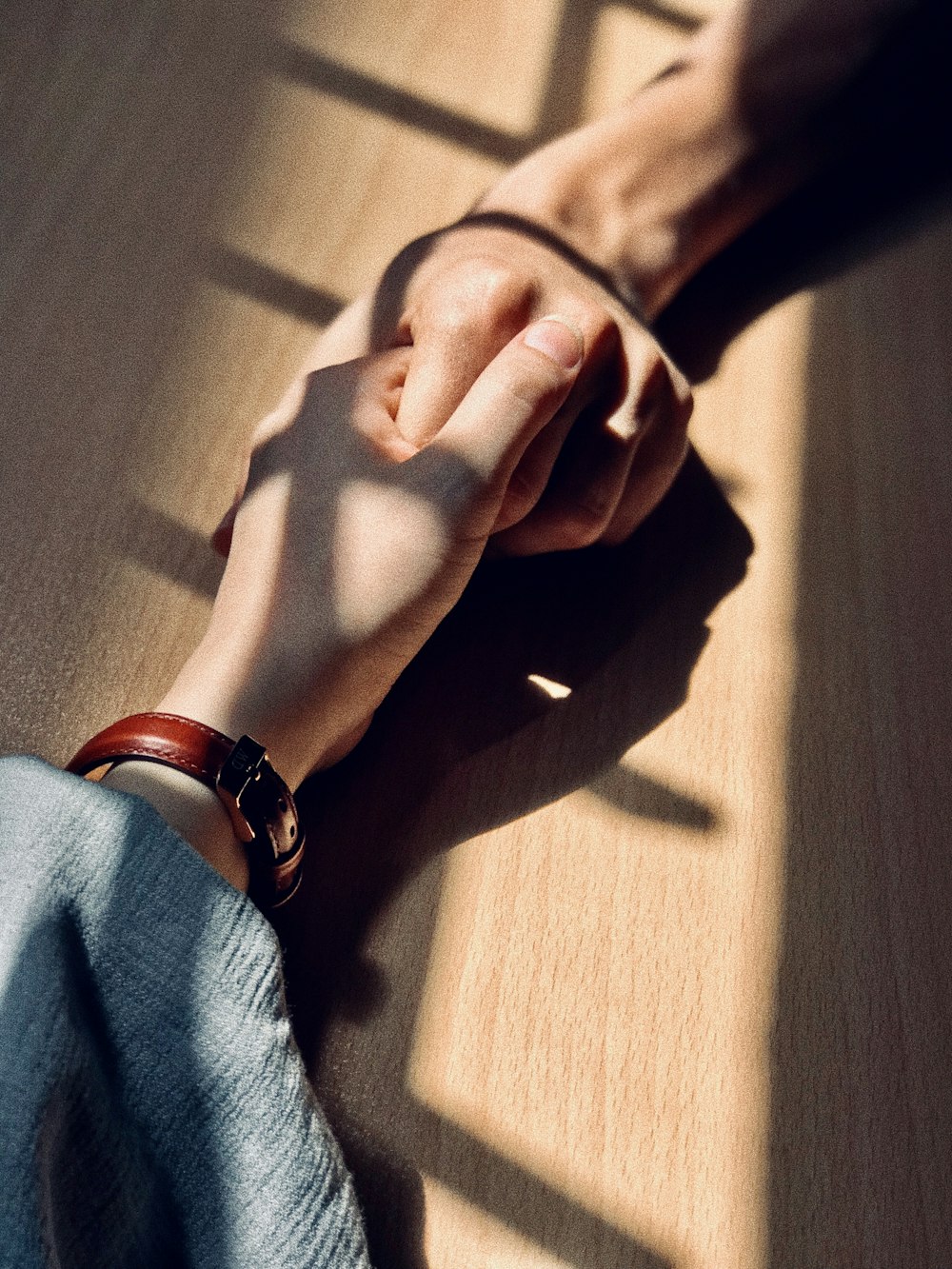 a person holding the hand of another person