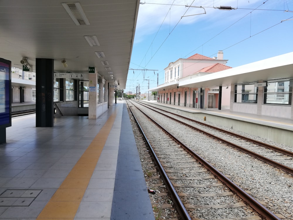 a train station with a train on the tracks