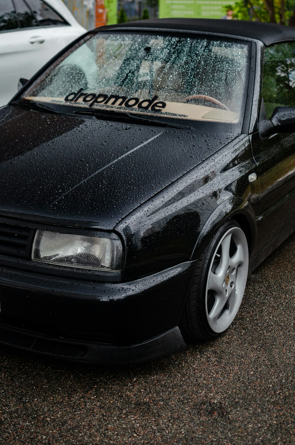 a black car parked on the side of the road