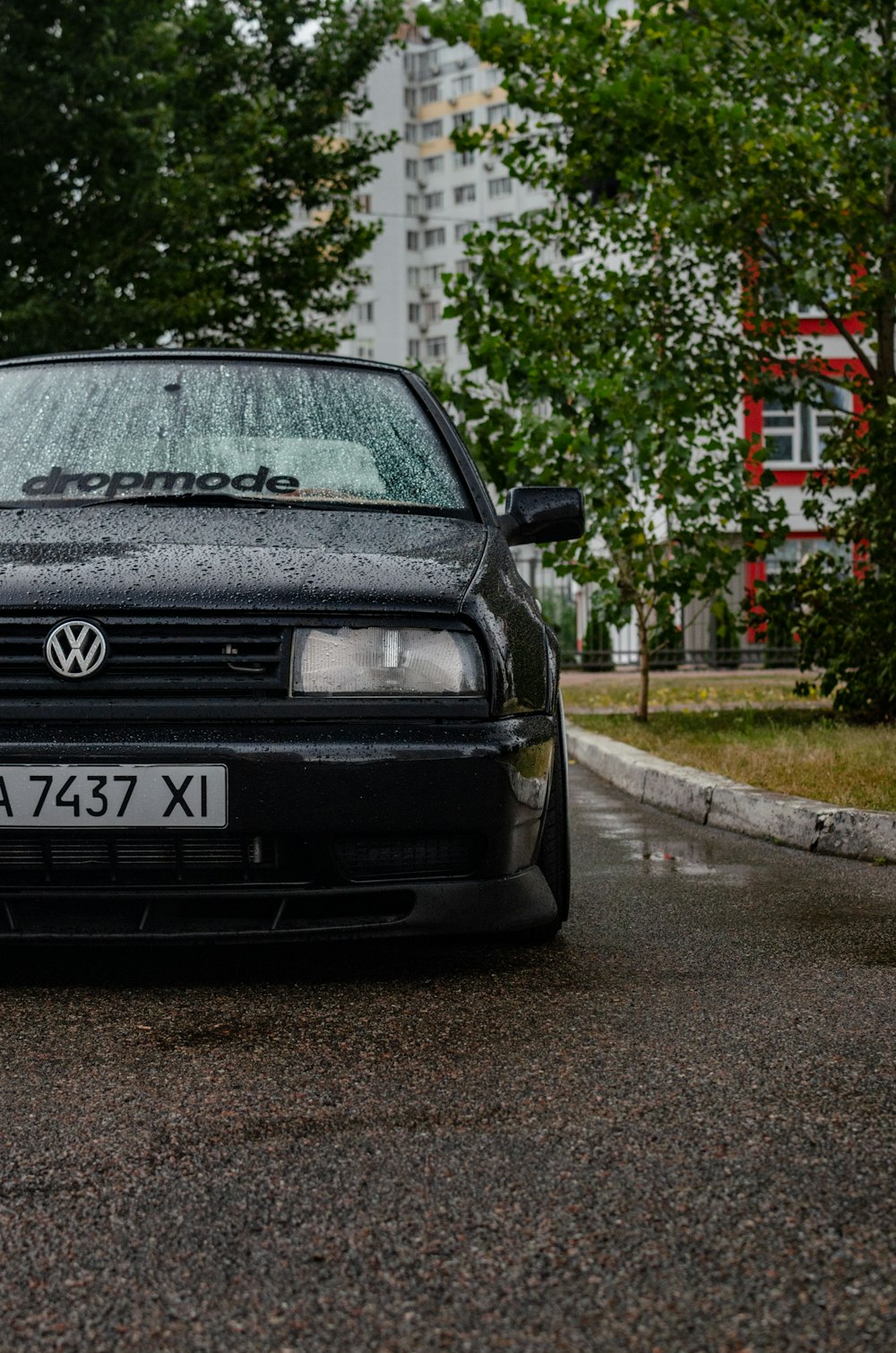 a black car parked on the side of the road