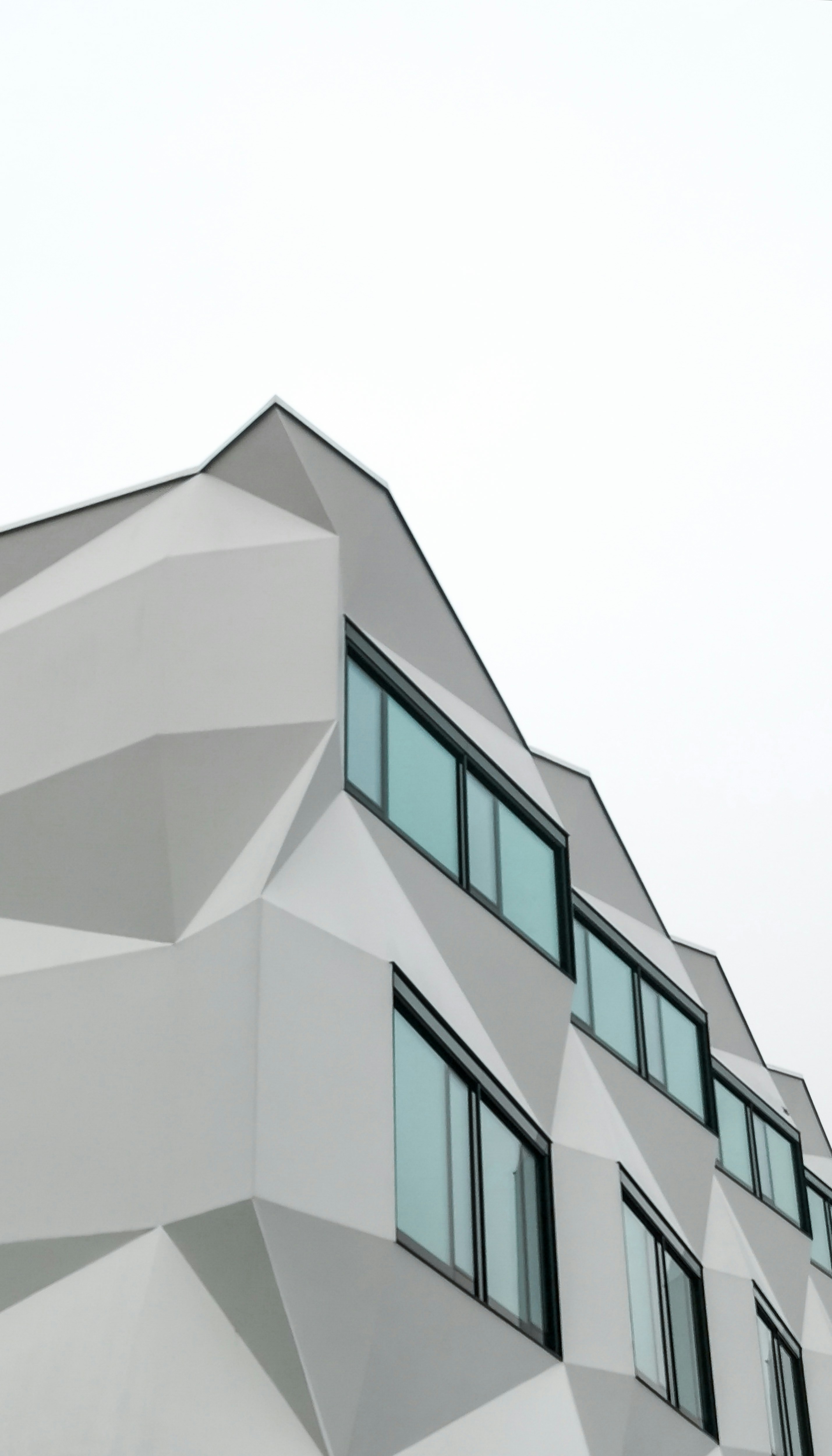 a white building with many windows on the side of it