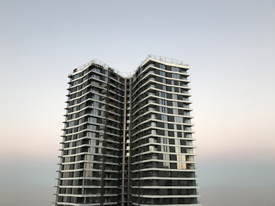 a couple of tall buildings sitting next to each other