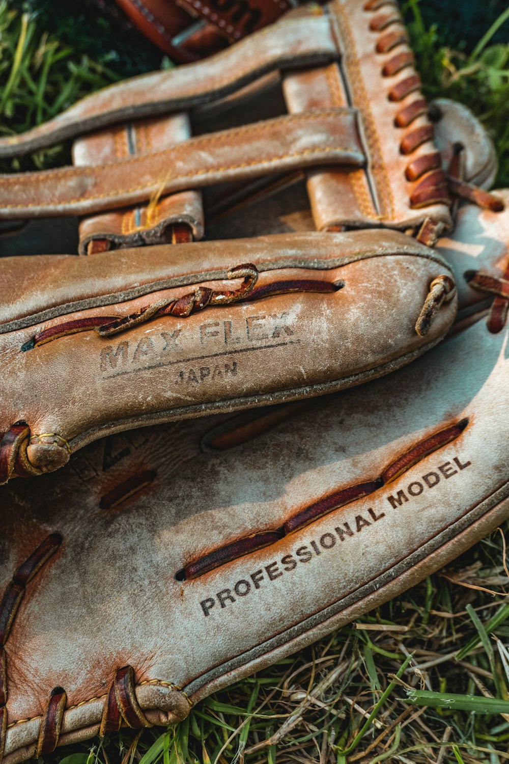 an old baseball glove laying on the ground