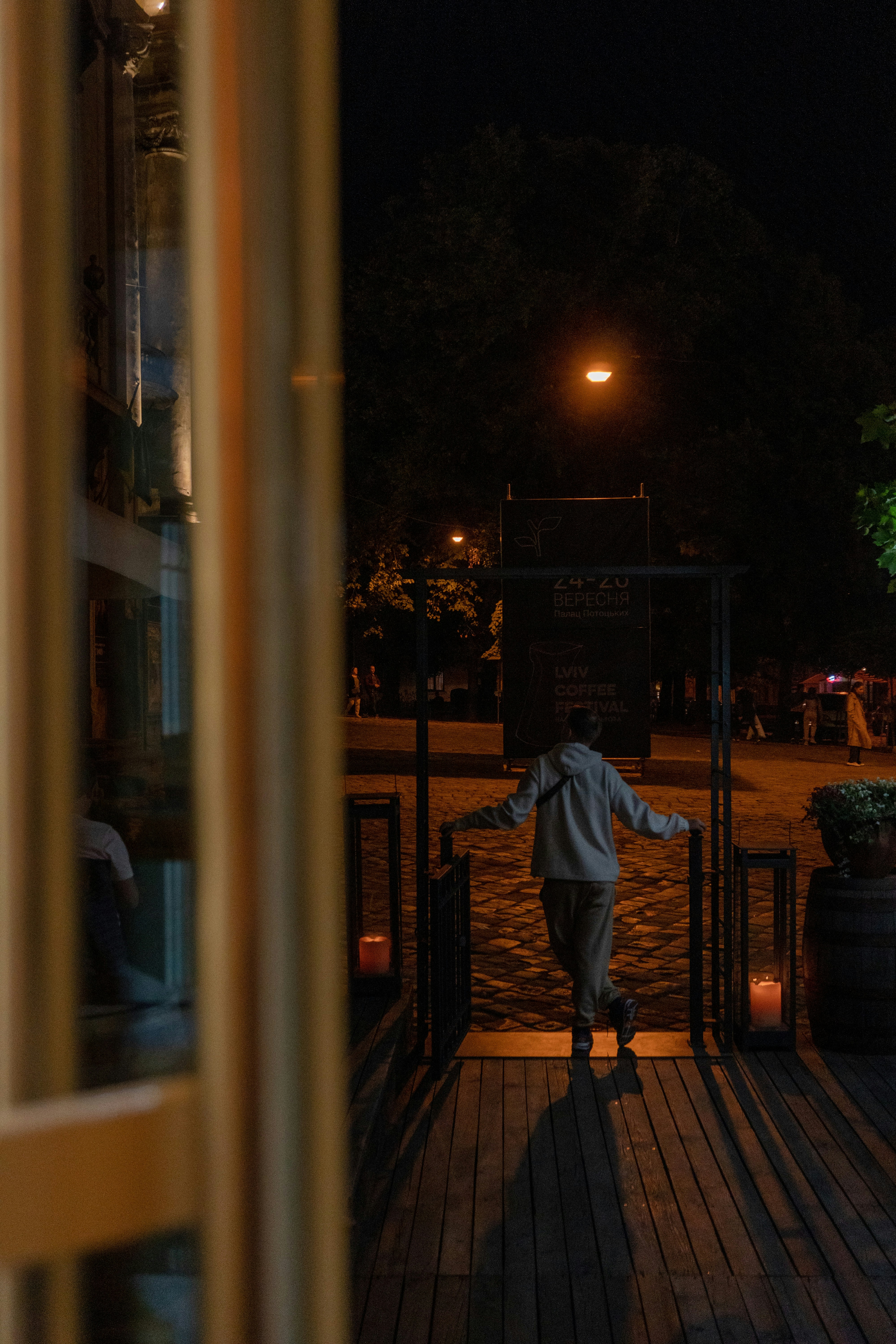 a person standing on a porch at night