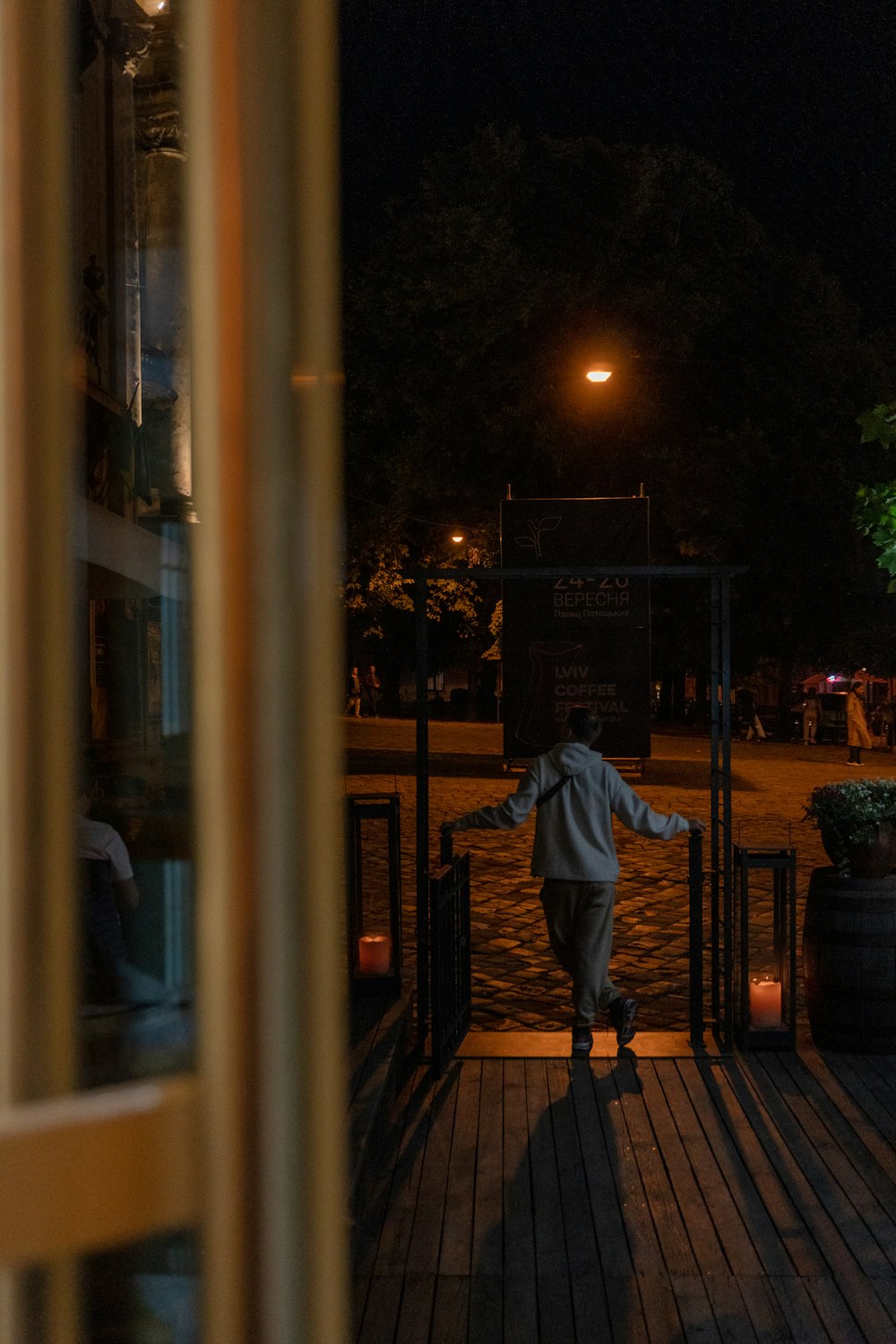 a person standing on a porch at night