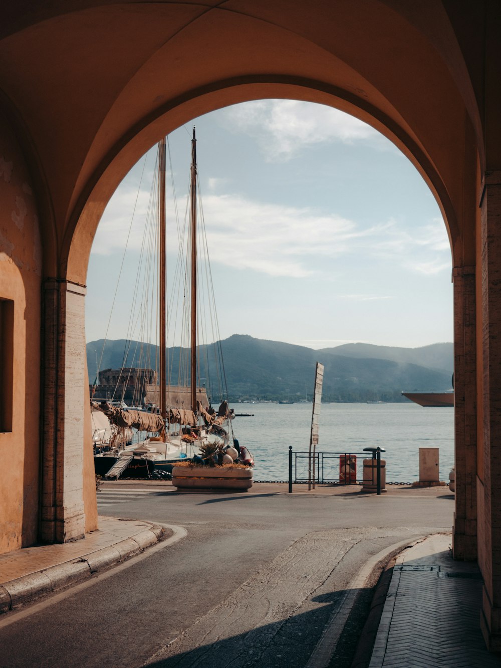 a sailboat is docked in a harbor