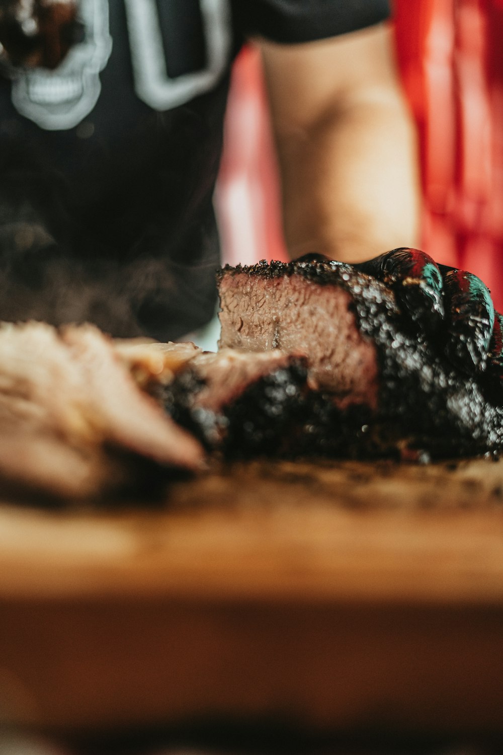 a close up of a piece of meat on a cutting board