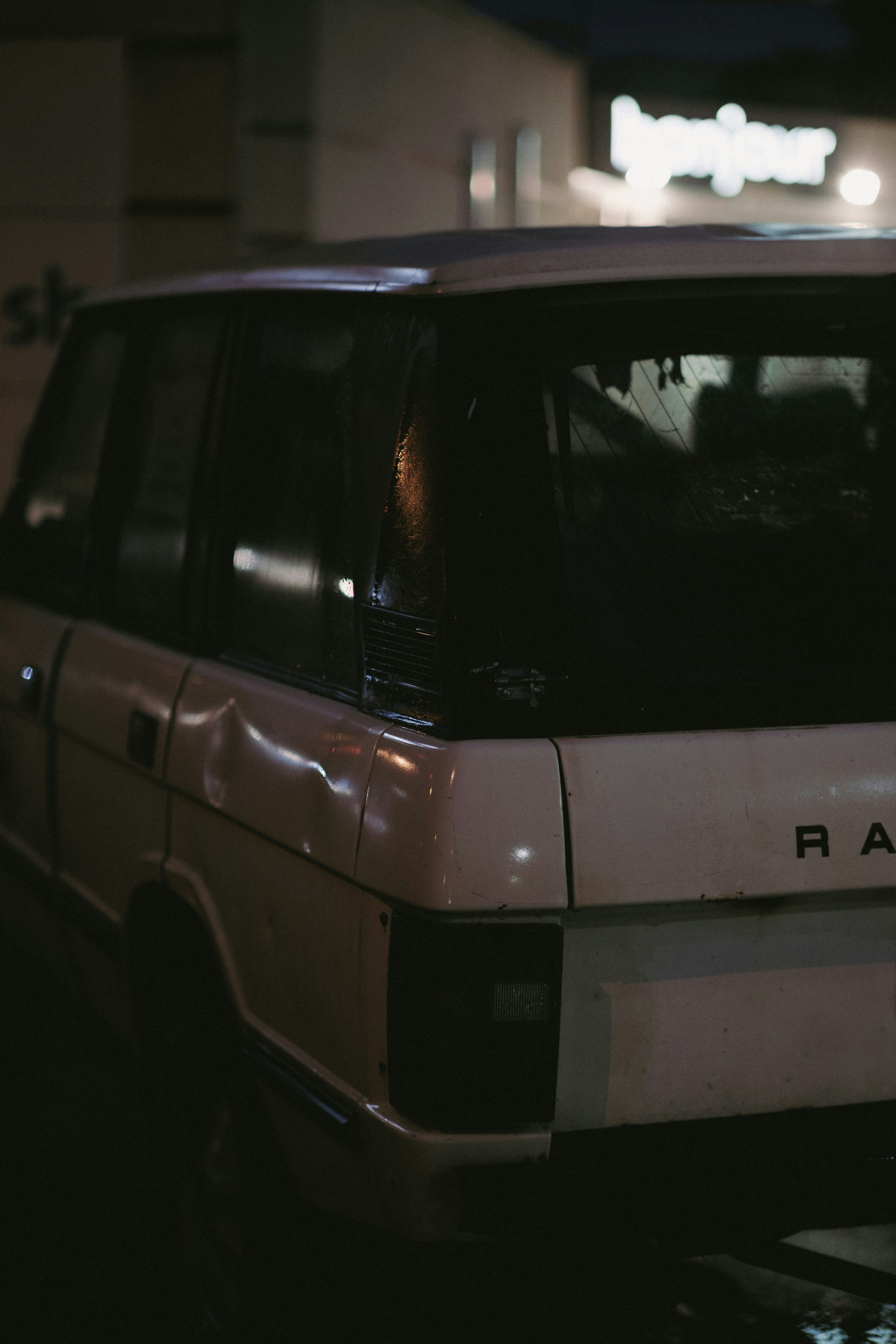 a white van parked on the side of a street