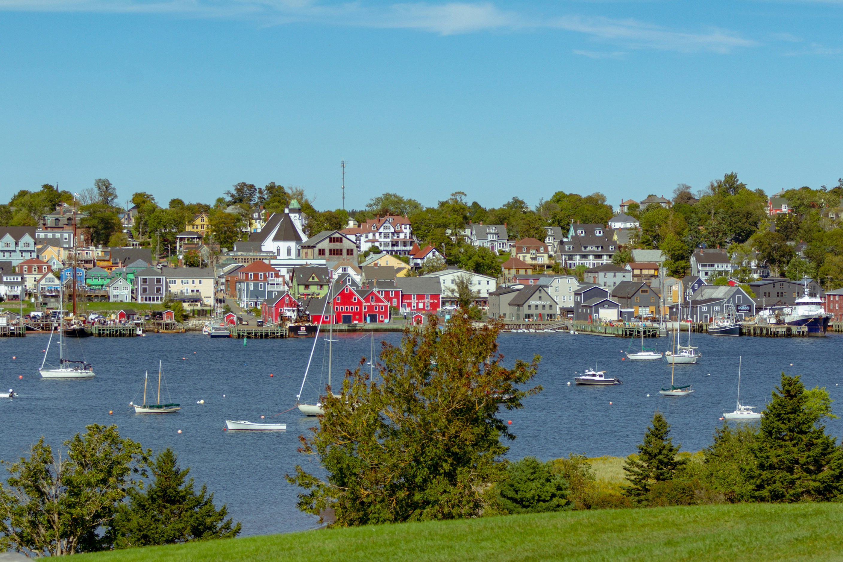 a harbor filled with lots of boats on top of a lake, 