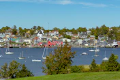 a harbor filled with lots of boats on top of a lake