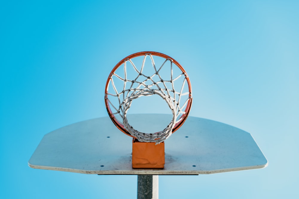 a basketball going through the rim of a basketball hoop