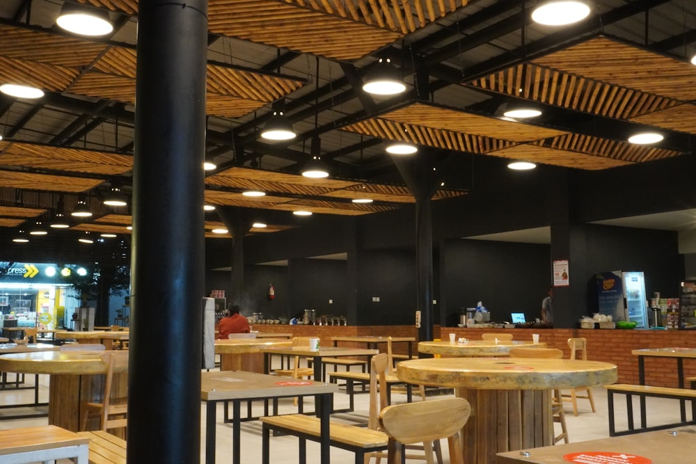 a restaurant with wooden tables and chairs