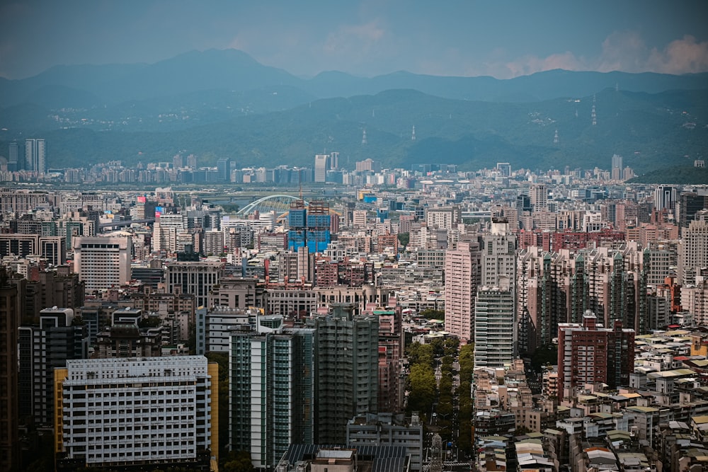 a view of a city with mountains in the background