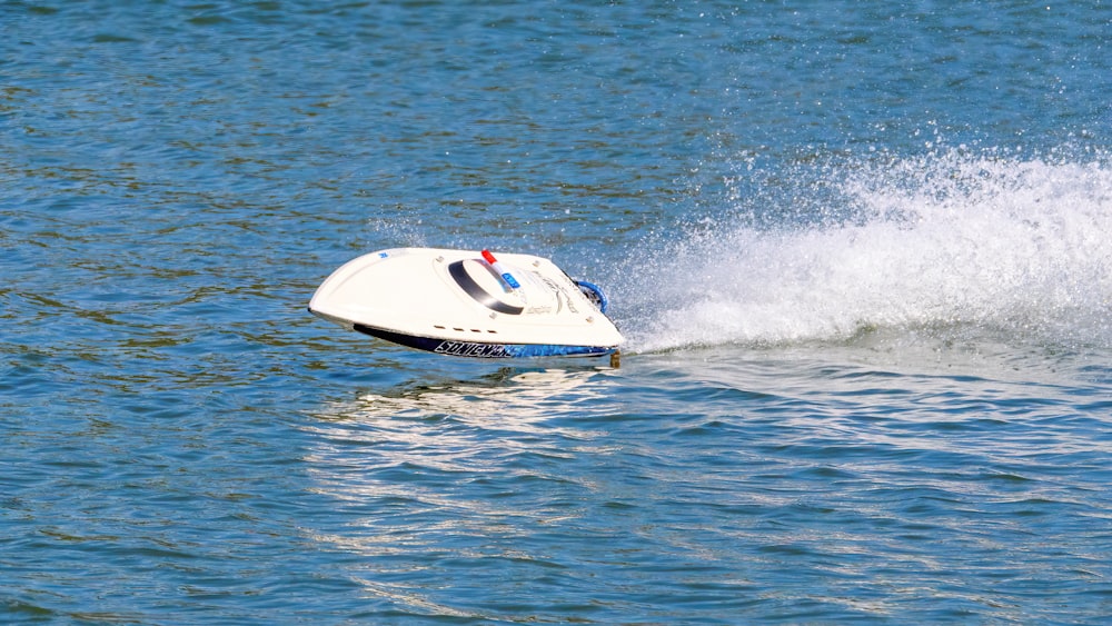 a jet ski being pulled by a boat in the water