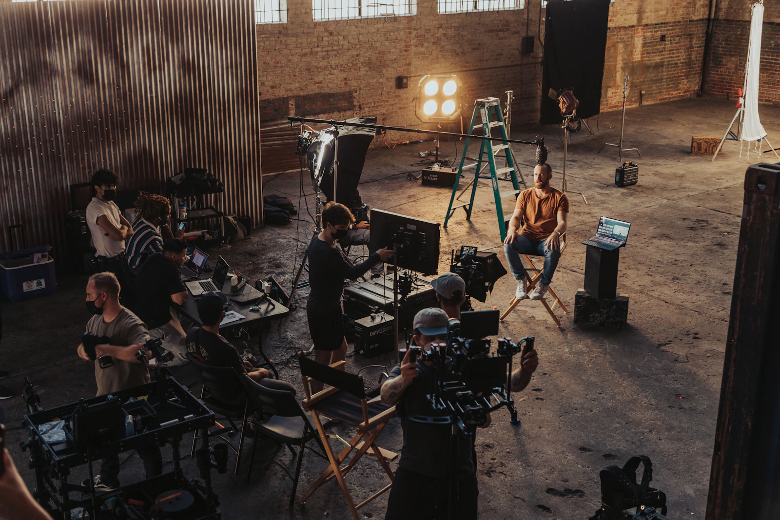 News crew gathered around a camera setup on location