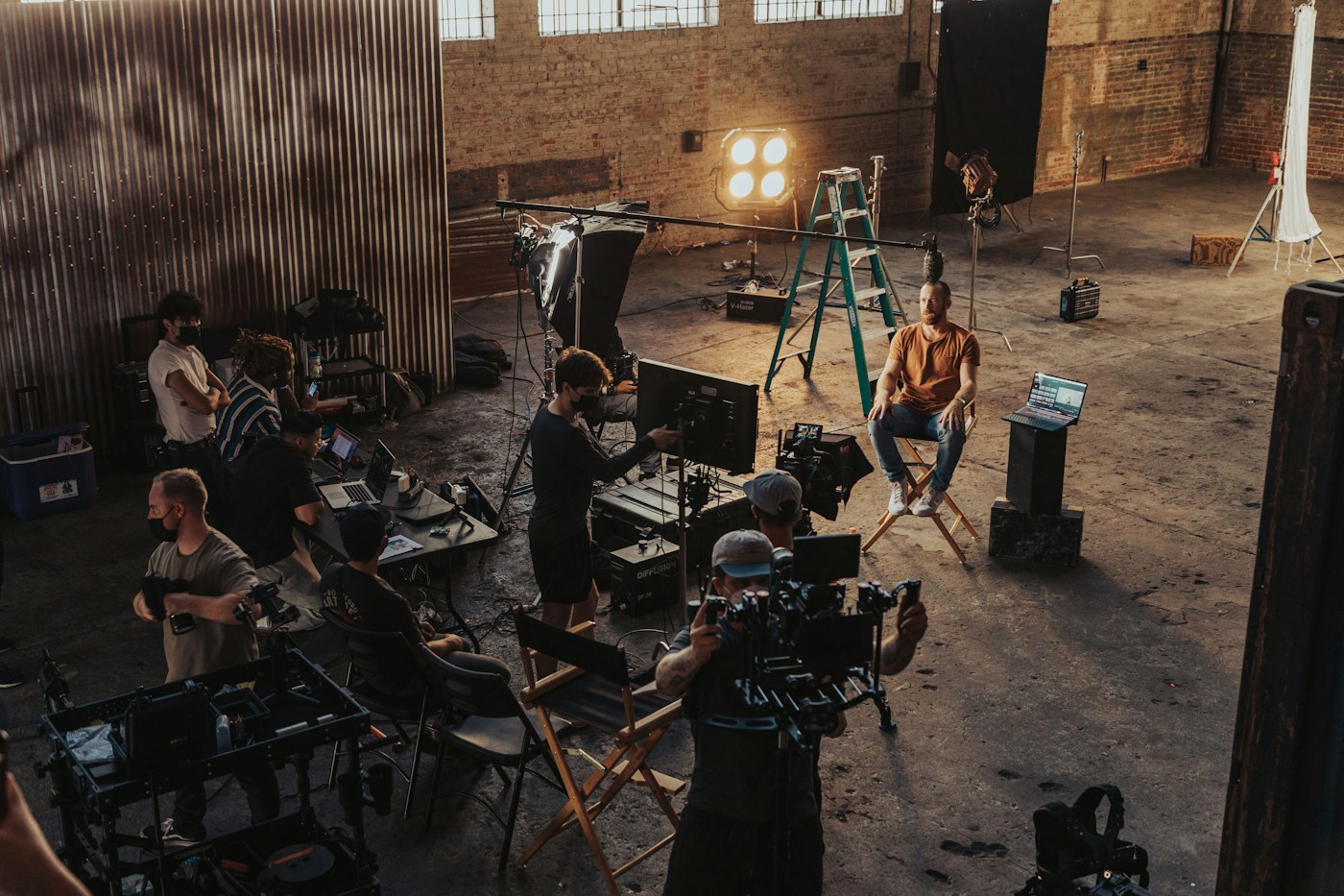 Crew and director gathered around a camera set-up at night, placeholder collaboration image