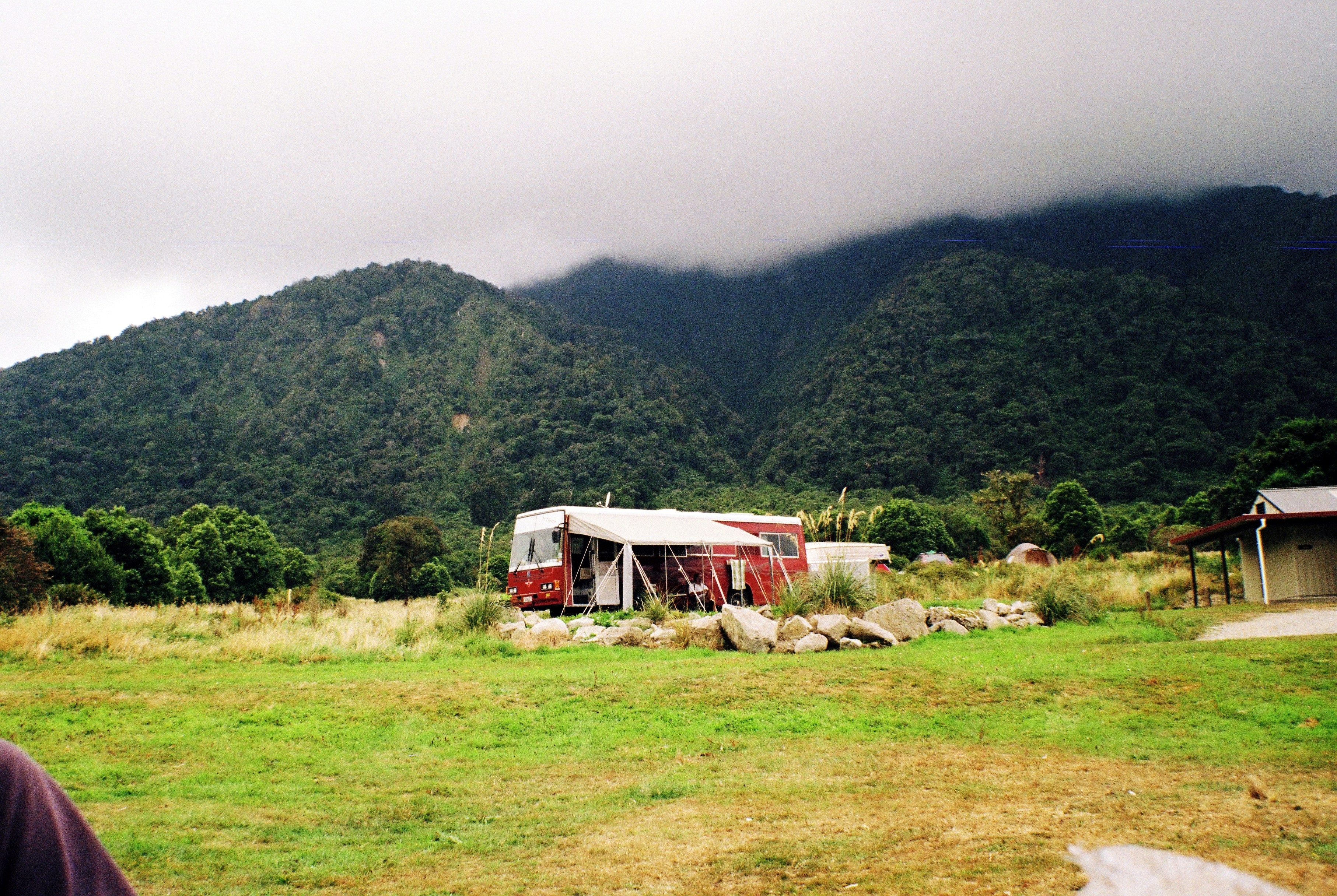a bus that is sitting in the grass