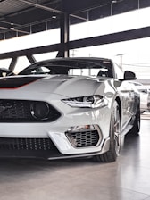 a white sports car parked in a garage