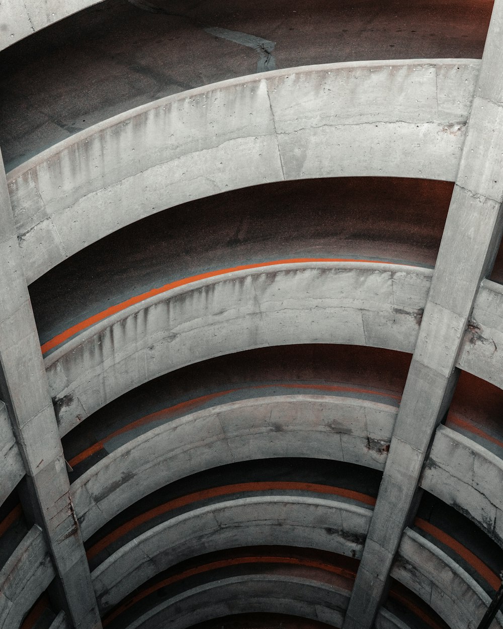 a close up of a concrete structure with orange lines