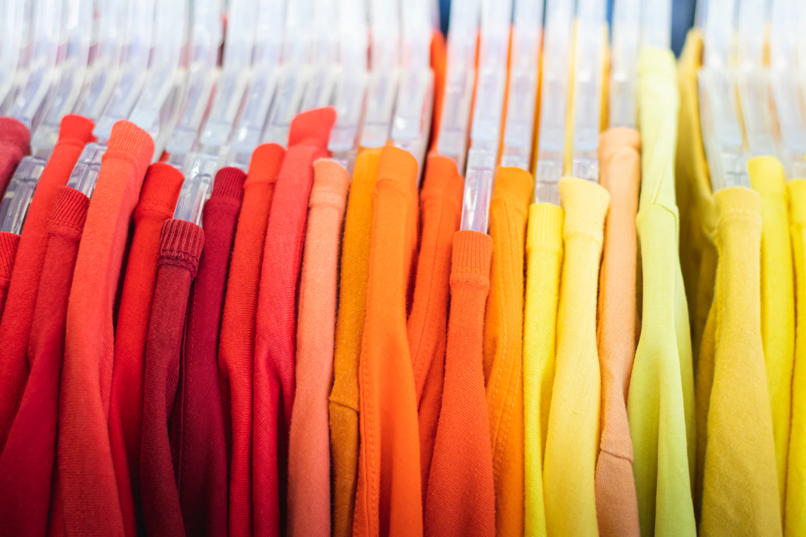 Shirts hanging in rainbow color order
