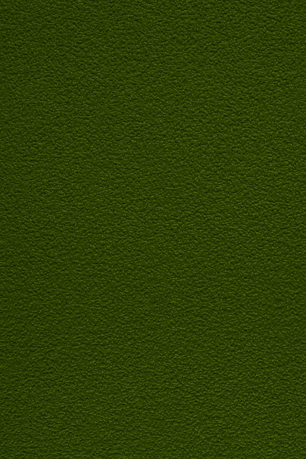 um close up de uma superfície verde com um pequeno pedaço de grama