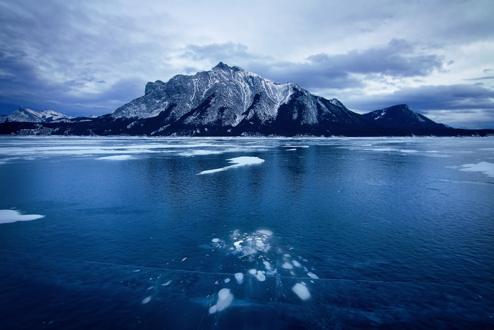 a view of a mountain range from the water