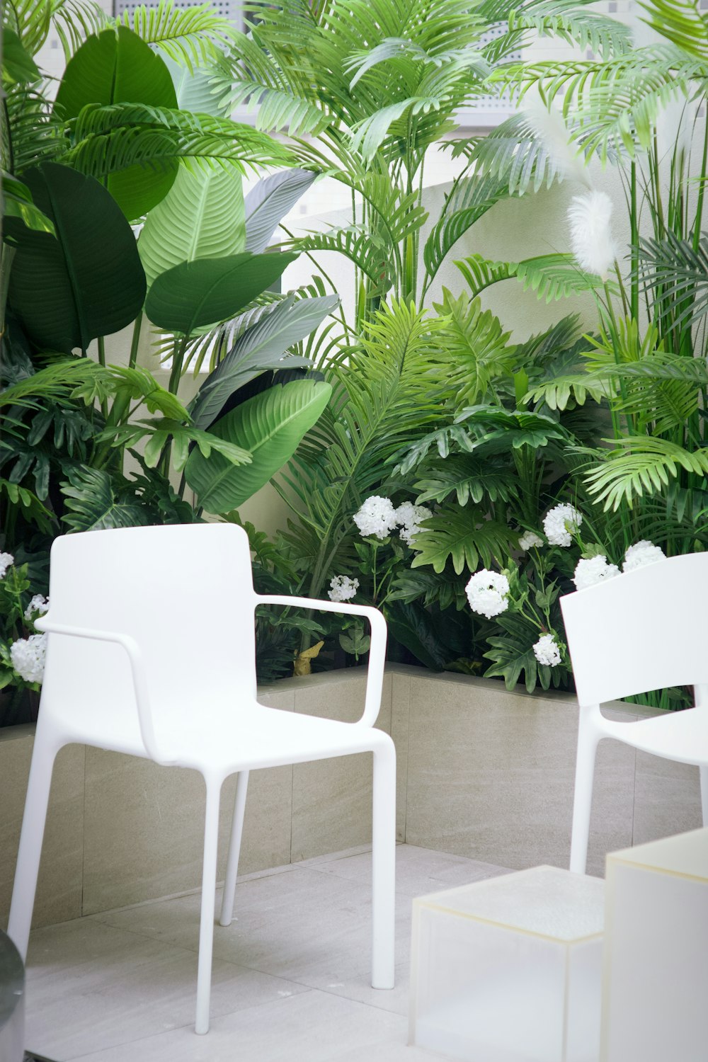 a couple of white chairs sitting next to each other