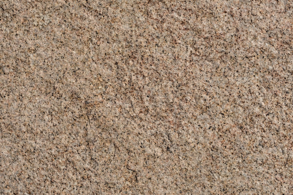 a close up of a brown granite surface