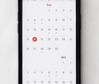 a phone with a calendar on the screen
